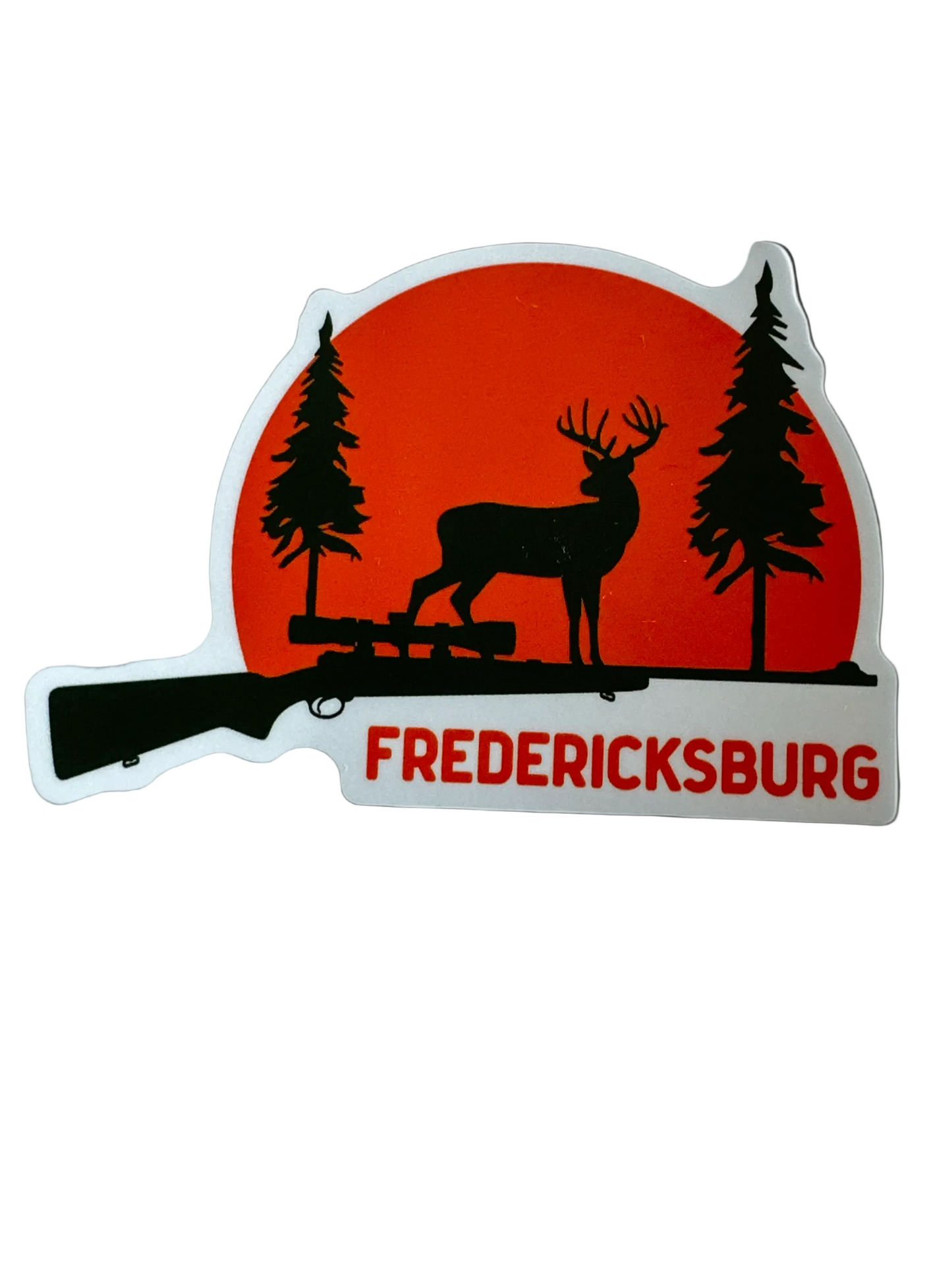 Deer rifle silhouette sticker with black deer, rifle, pine trees and “FREDERICKSBURG” text