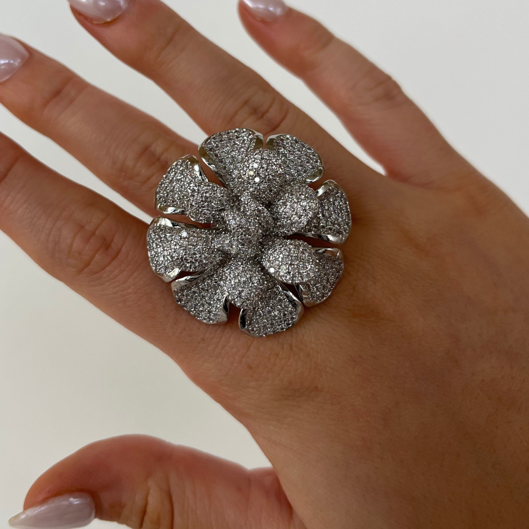 Blooming pavé flower ring, silver tone with sparkling petal stones on finger