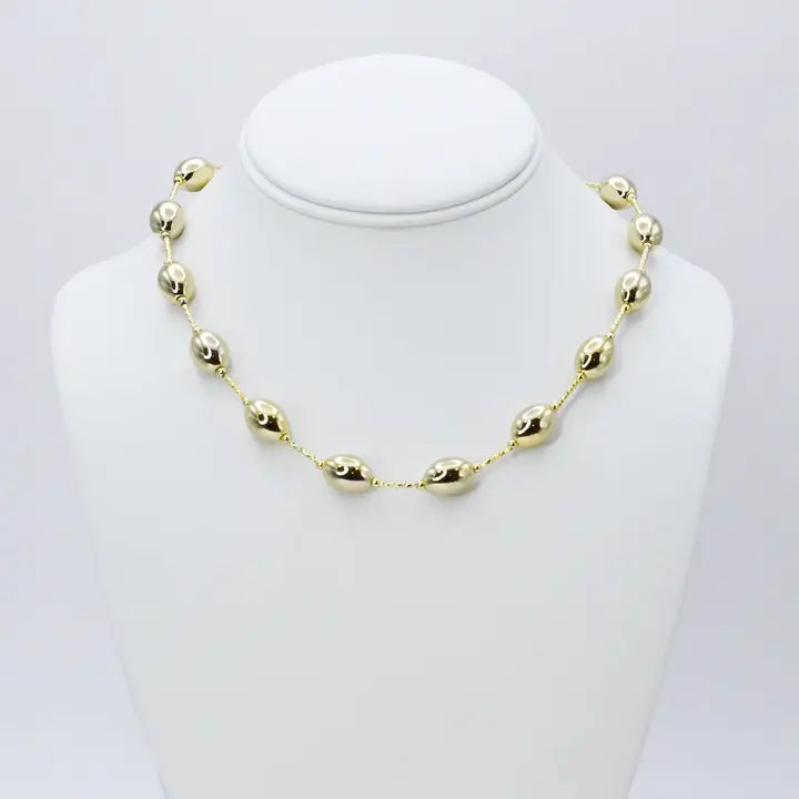 Gold magnets necklace featuring evenly spaced oval beads and small ring links, G21