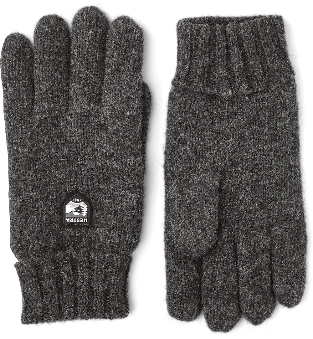Pair of dark gray Basic Wool Glove made from soft wool with ribbed cuffs, designed for warmth and comfort in a classic, durable style.