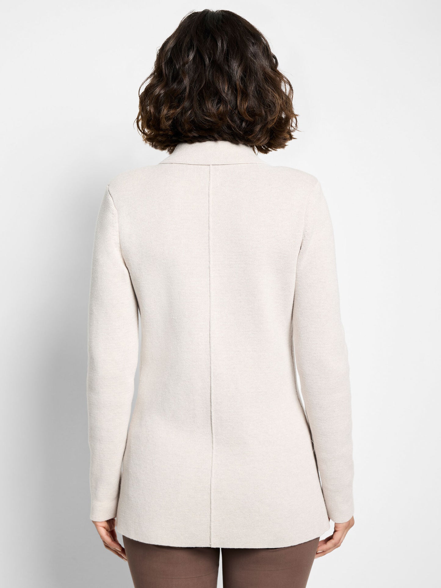 Back view of sugar cookie knit blazer with center seam and long sleeves