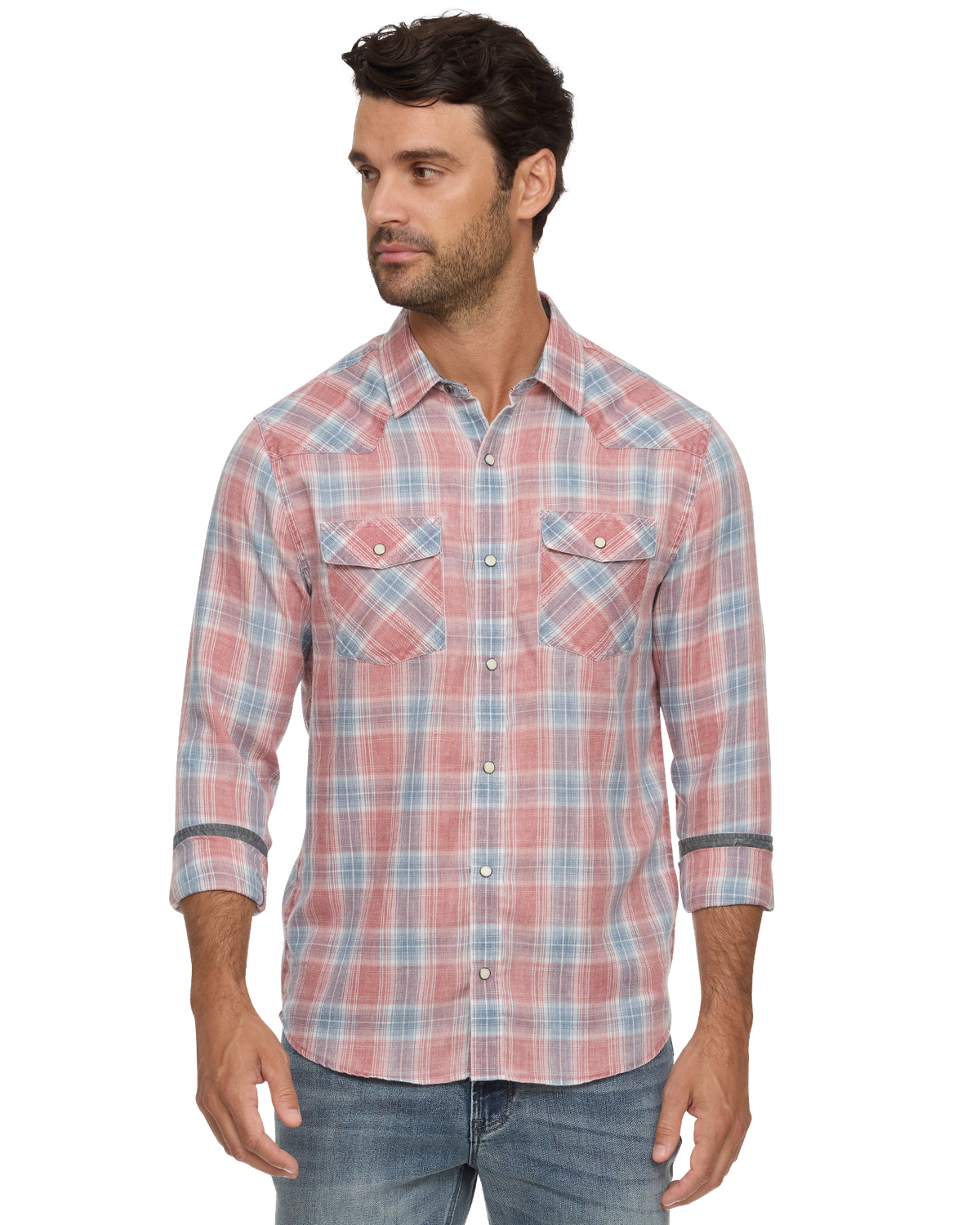 Man wearing a coral and blue plaid button-down shirt