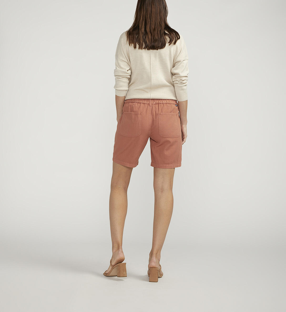 Tailored Short 8" in muted rust, styled with neutral top and heels, curated Fredericksburg TX