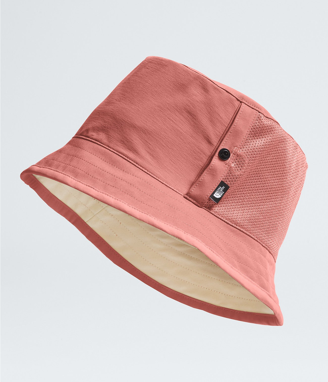 Class V Reversible Bucket Hat in muted terracotta and beige tones, featuring breathable mesh side panels and durable fabric, embodying authentic Hill Country style.