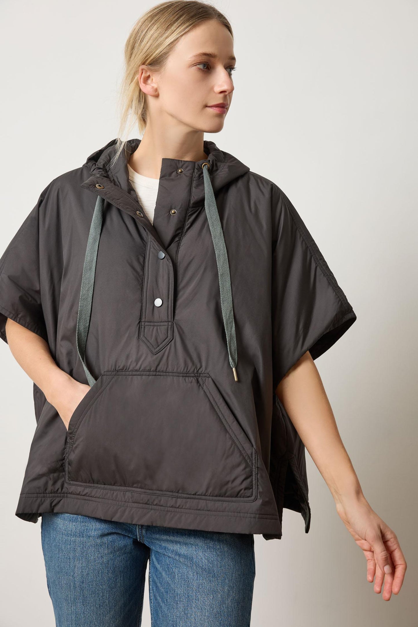 Hooded Poncho in black insulated nylon with oversized fit and contrast drawcords by LILLA P