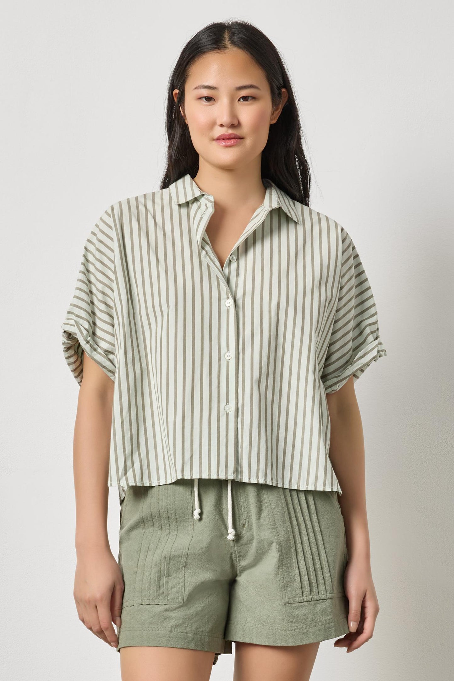 Model wearing Striped Oversized Button Down Dolman by LILLA P, styled with casual green shorts
