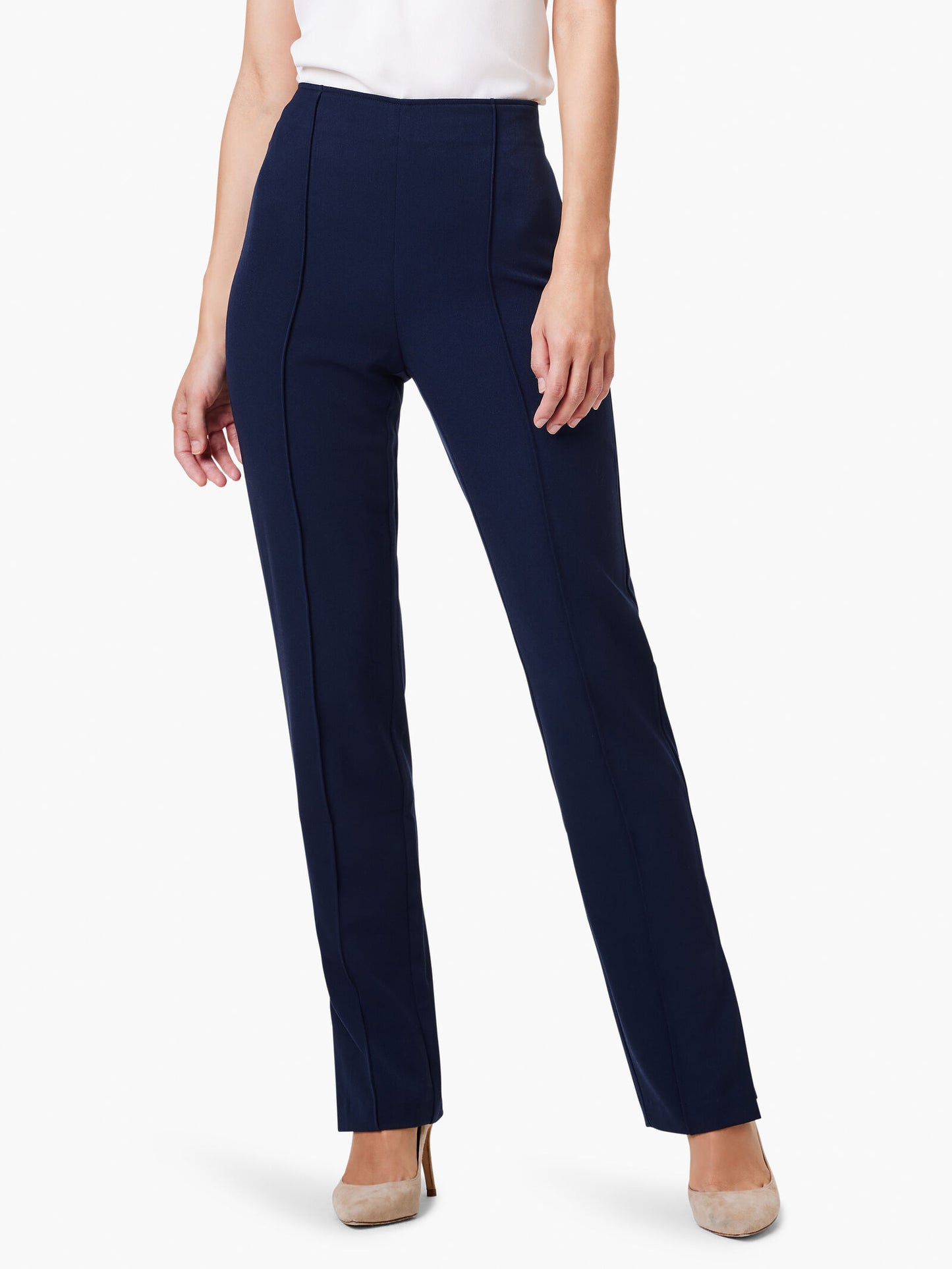 Woman wearing navy blue 31" Avenue Side Slit Straight Pant paired with beige heels, showcasing a sleek, tailored fit perfect for boutique clothing and effortless Hill Country style.