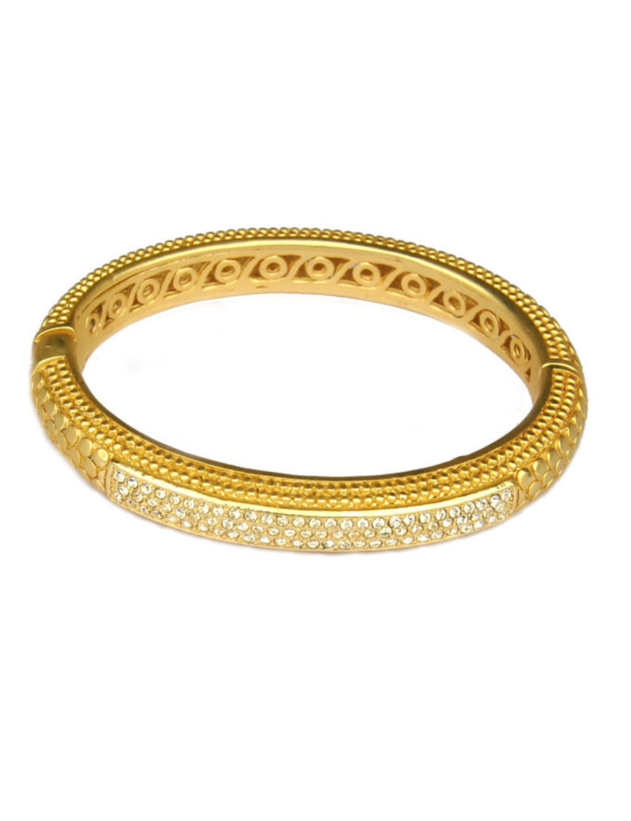 Gold-tone bangle with pave stones and engraved oval design