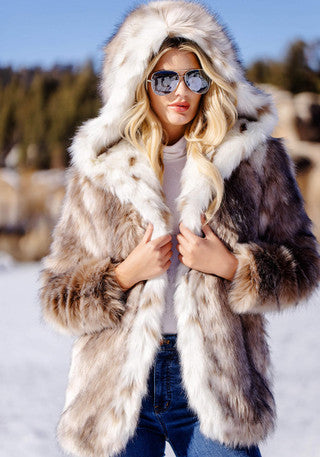Hooded fur coat with lynx spotted sections and plush collar