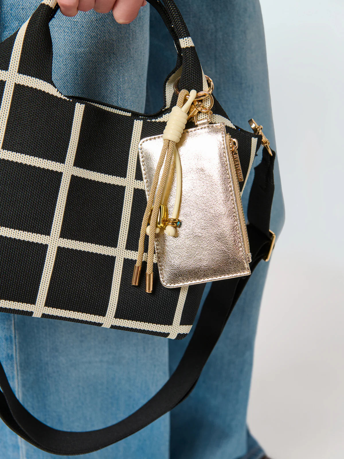 Robbie Mini Tote in black and white checkered pattern with gold-accented pouch by SHIRALEAH