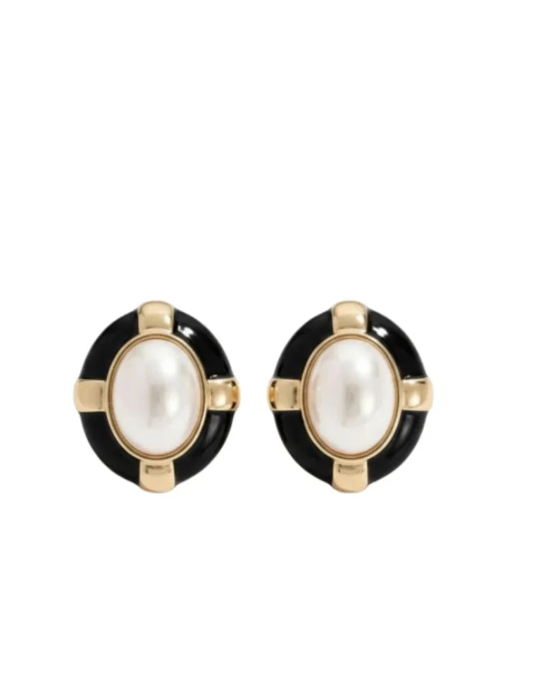 Pair of earrings with black and gold accents on a white background