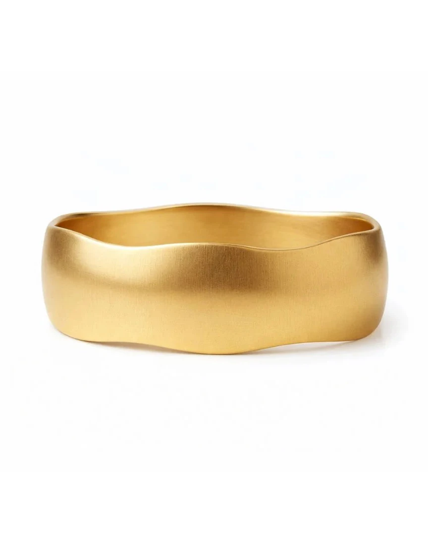 Gold bracelet on a white background