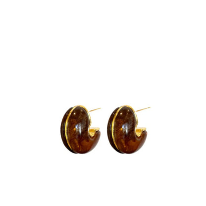 Carson Hoop earrings in tortoise with gold-tone inner edge and hinge backs