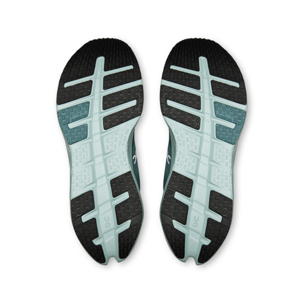 Pair of running shoe soles with black and pale blue traction patterns