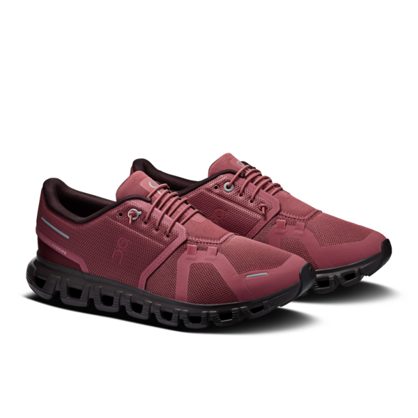 Pair of burgundy lace-up athletic shoes with black soles