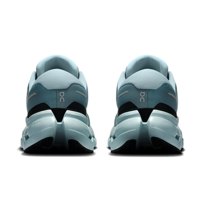 Two blue gray running shoes seen from behind