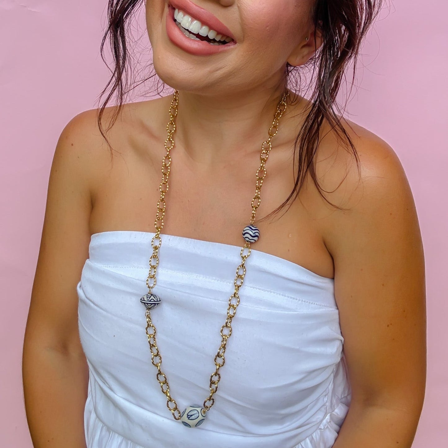 Chinoiserie Chic Necklace with hand-painted blue and white ceramic beads on a gold chain, curated Fredericksburg TX