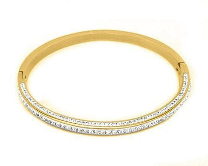 Steel Gold Pave Bangle featuring a sleek gold design with two rows of sparkling pave stones, offering a timeless and elegant accessory for effortless Hill Country style.