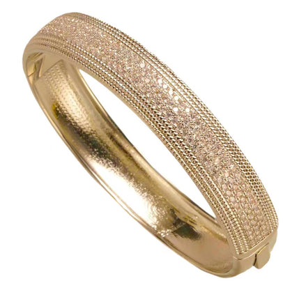 Gold pave bangle, close view of textured stone mesh surface