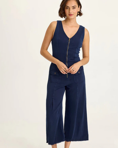 Linette Jumpsuit in navy Taissa Twill with brass zipper, flap pockets, and cropped wide leg by XCVI