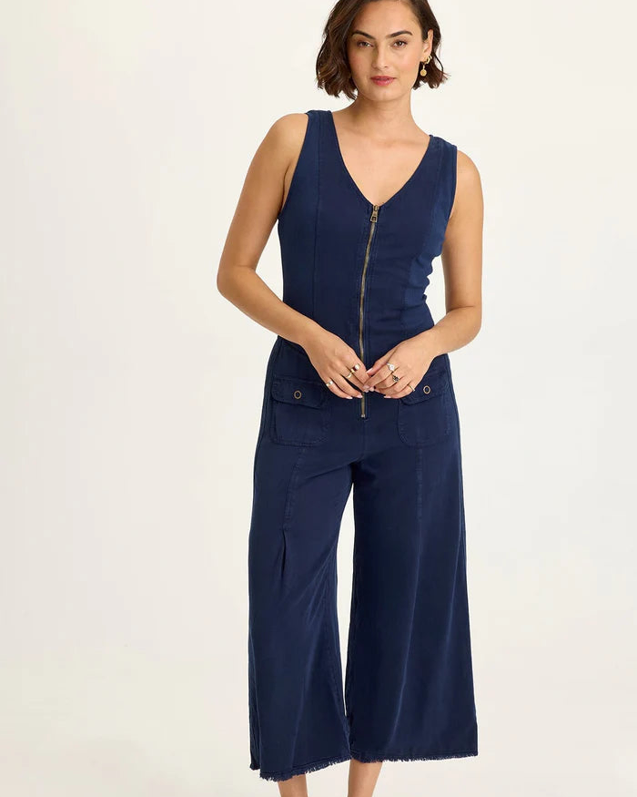 Linette Jumpsuit in beige Taissa Twill with zipper front, flap pockets, and ribbed sides by XCVI