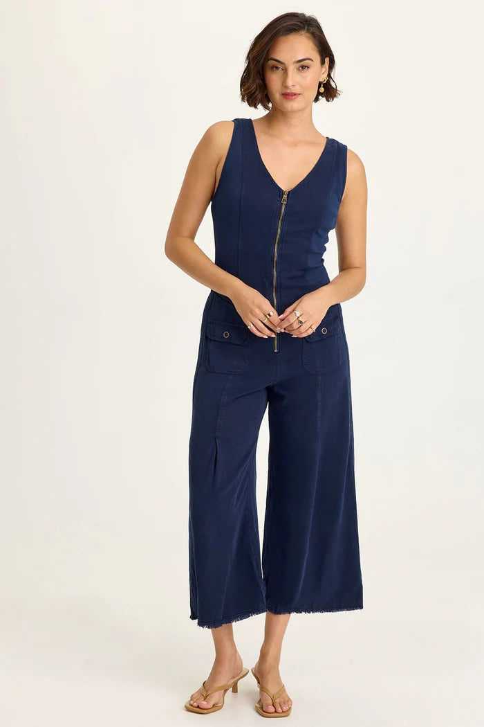 Linette Jumpsuit in navy Taissa Twill with brass zip, flap pockets, and cropped wide leg by XCVI