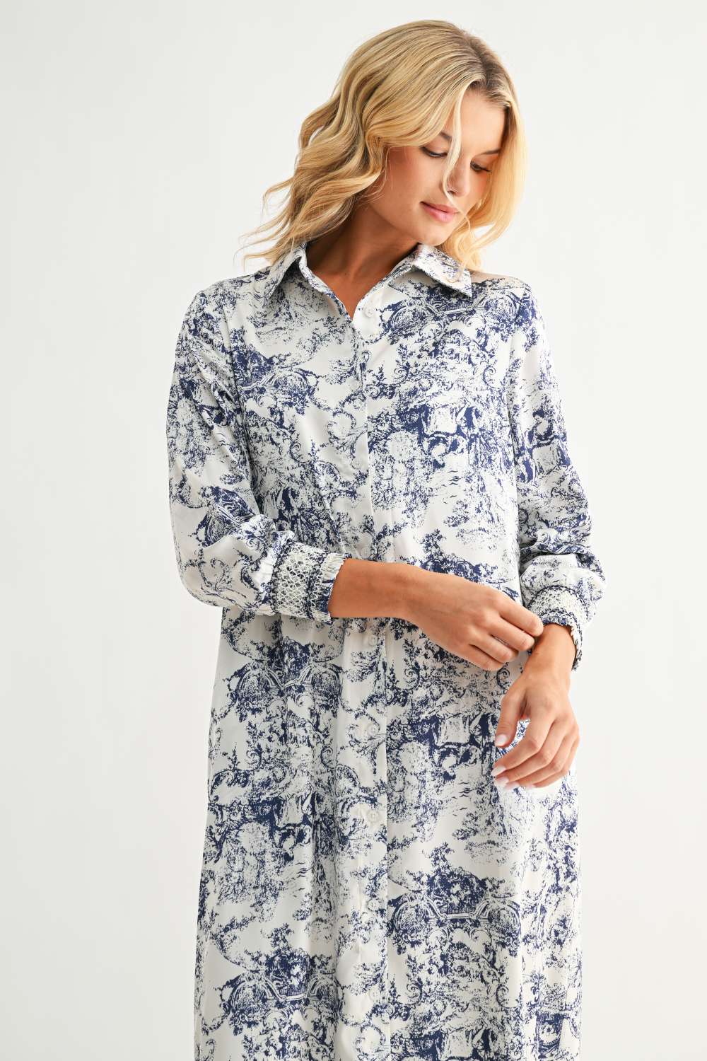 Janett Dress with blue and red floral toile print, collared neckline, long cuffed sleeves