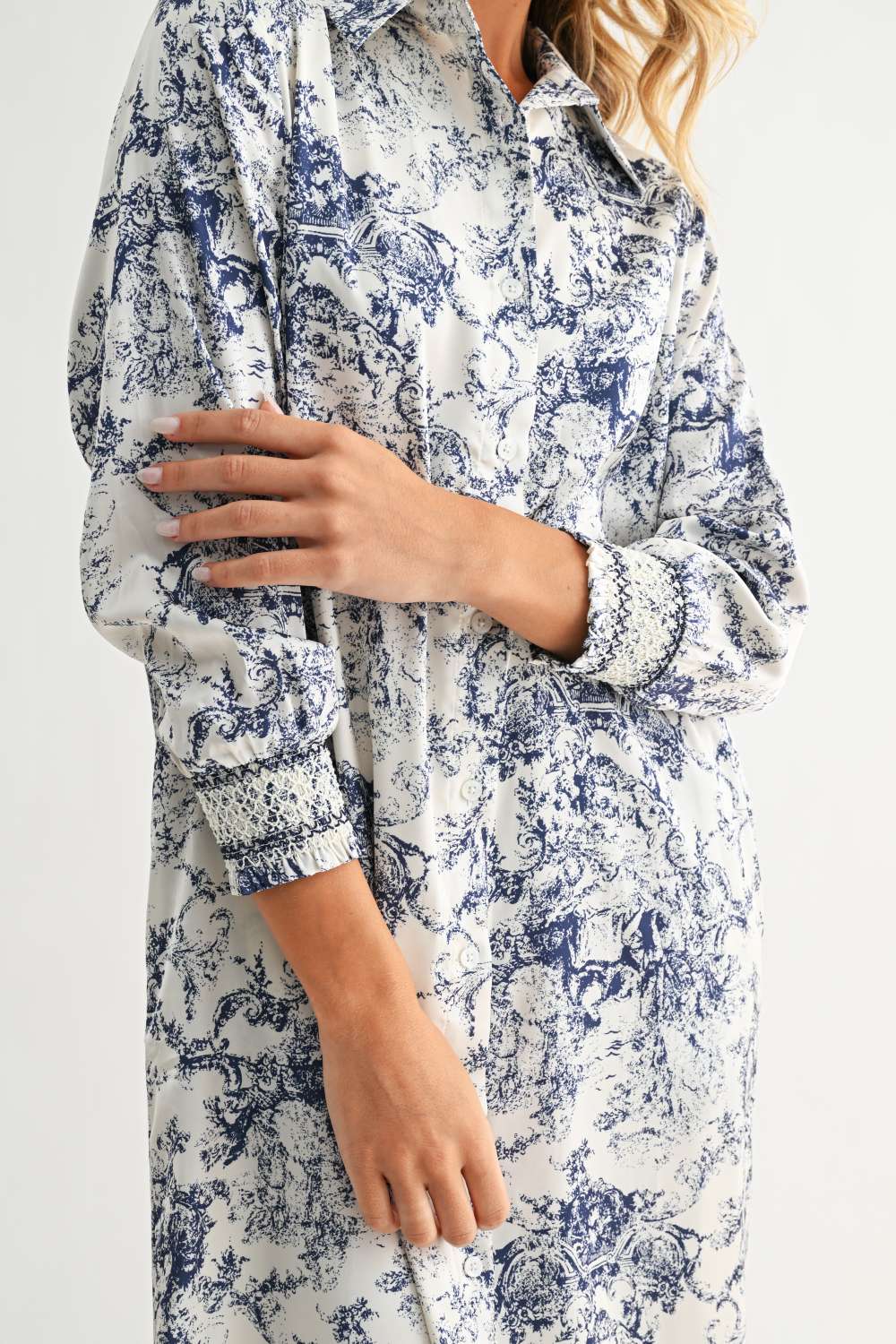 Janett Dress with blue toile floral pattern, collared neckline, and long cuffed sleeves by JOH APPAREL