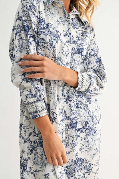 Janett Dress with blue toile floral pattern, collared neckline, and long cuffed sleeves by JOH APPAREL