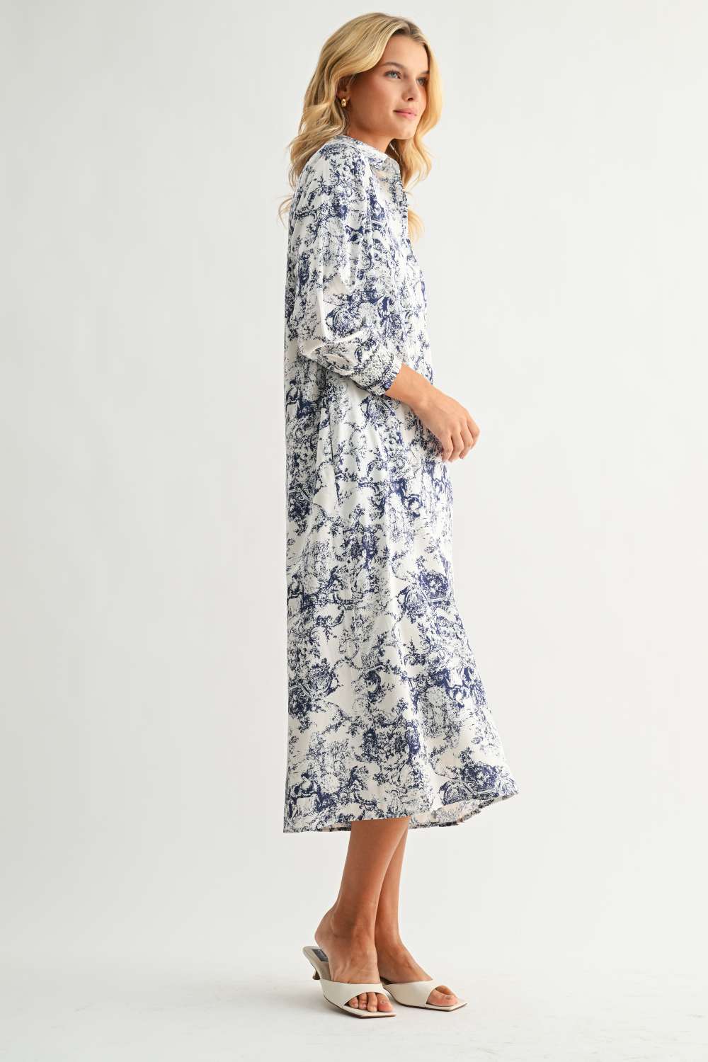 Janett Dress in blue floral toile print with collared neckline and long sleeves by JOH APPAREL