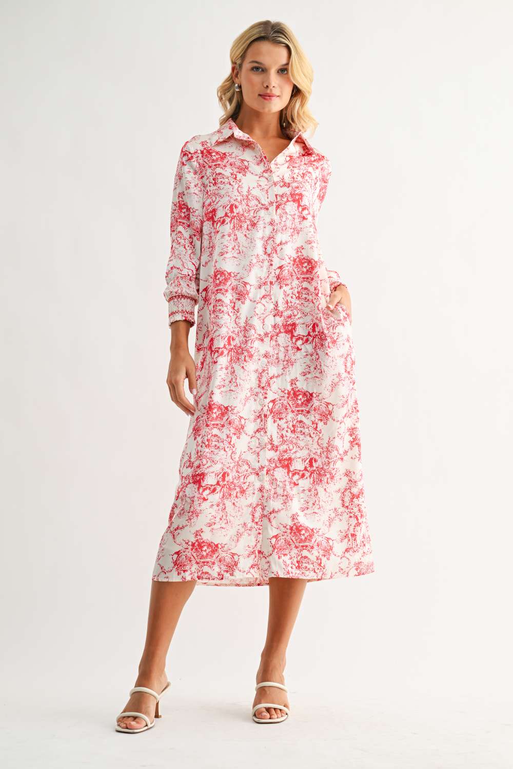 Janett Dress with red floral toile print, collared neckline, button front, and long cuffed sleeves