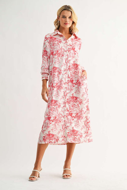 Janett Dress with red floral toile print, collared neckline, button front, and long cuffed sleeves