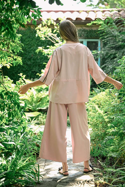 Jolie Top in blush woven parachute fabric with relaxed fit and wide striped sleeves by JOH APPAREL