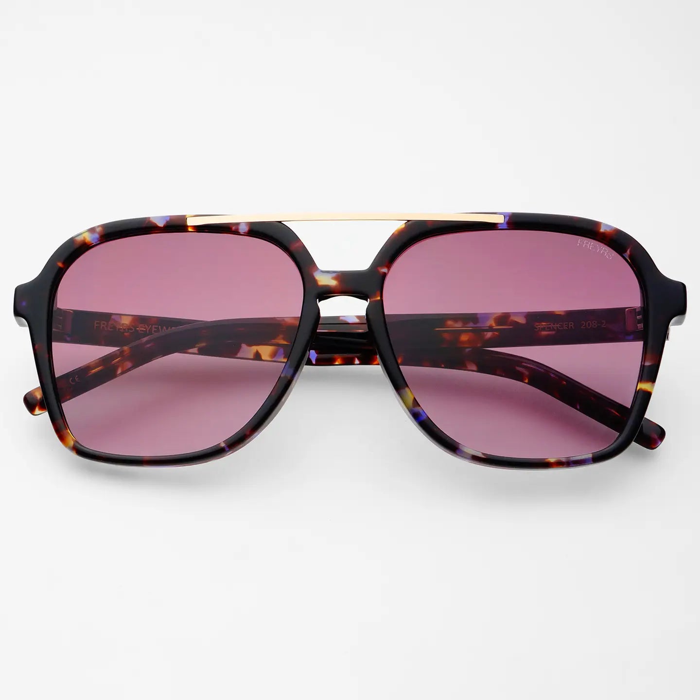 Spencer sunglasses with tortoiseshell frames, gold metal brow bar, and purple-tinted lenses, blending high-quality design with effortless Hill Country style.