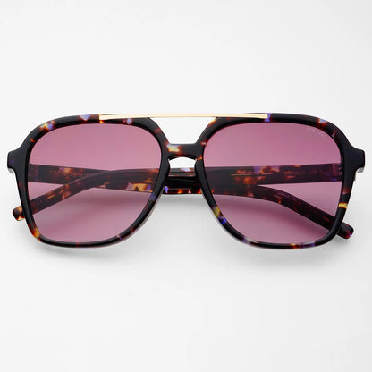 Spencer sunglasses with tortoiseshell frames, gold metal brow bar, and purple-tinted lenses, blending high-quality design with effortless Hill Country style.