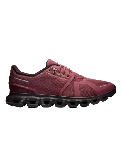 Burgundy athletic running shoe with black cushioned sole on a white background