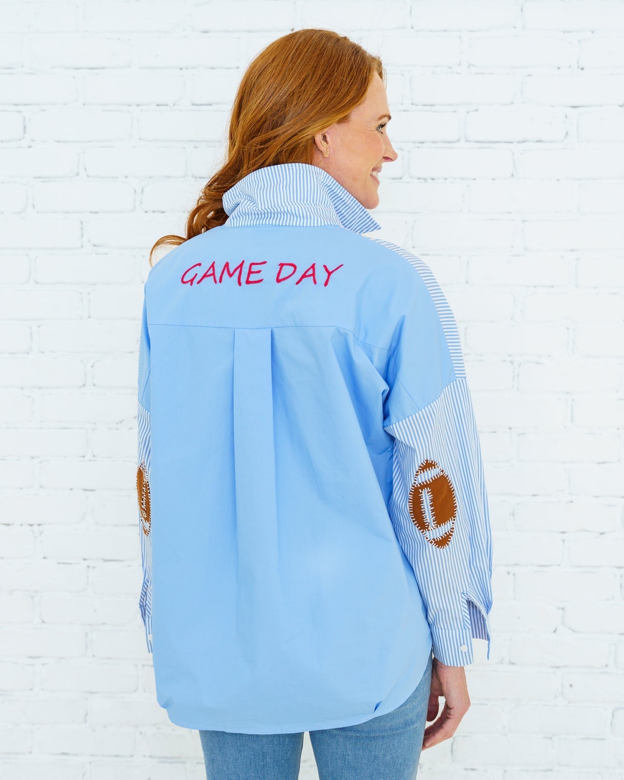 Woman wearing Preppy Football Shirt Powder Blue by CARYN LAWN with "GAME DAY" embroidery