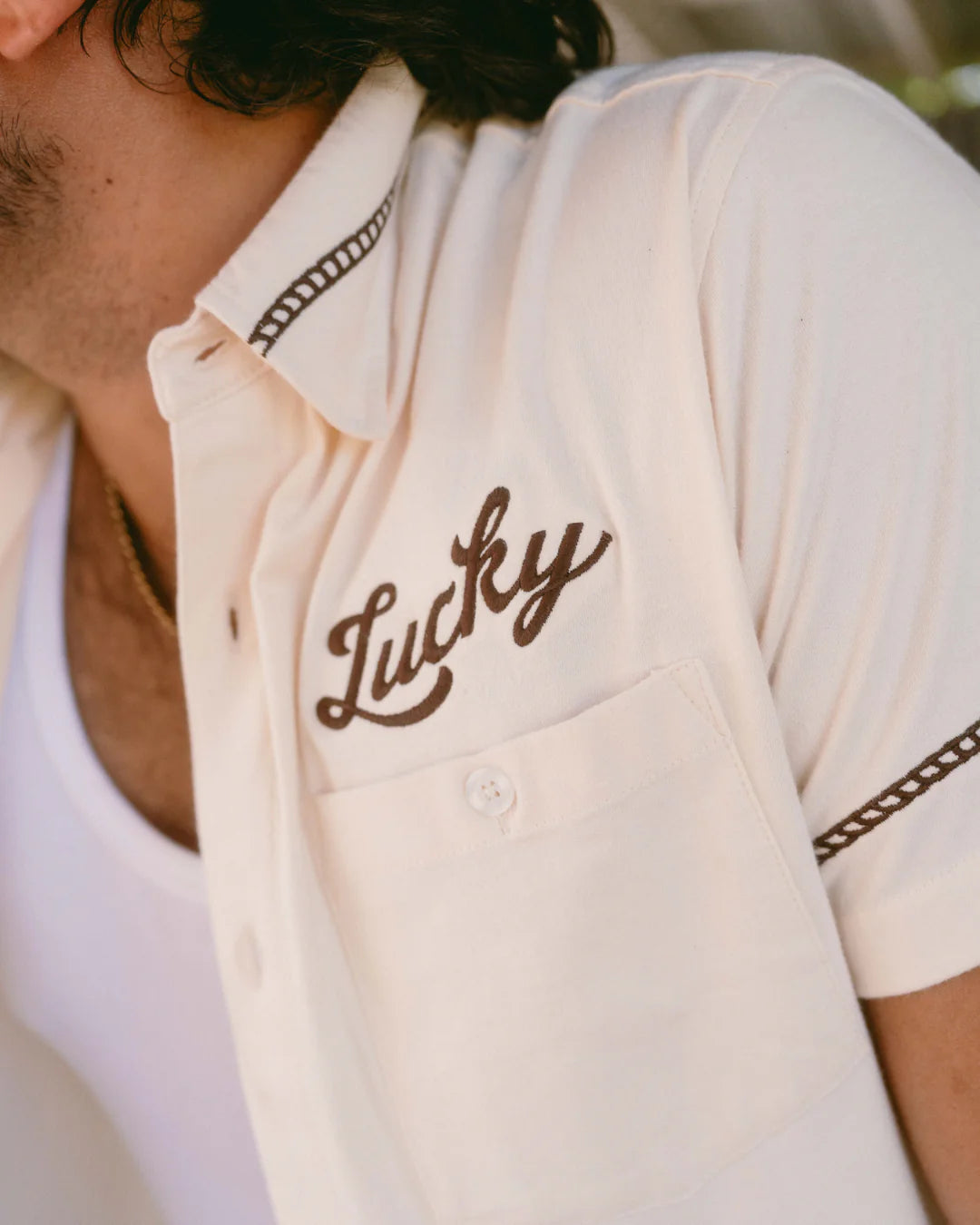 Drifter Shirt - Luck Is Earned beige short sleeve with brown "Lucky" embroidery by TEXAS STANDARD