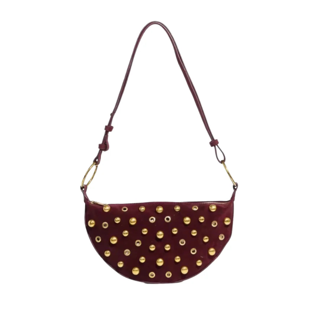Maeve Studded Bag in burgundy with gold-tone eyelet studs and shoulder strap