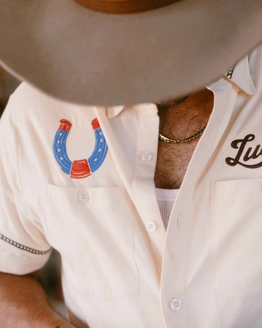 Drifter Shirt - Luck Is Earned beige short sleeve with blue and red horseshoe by TEXAS STANDARD