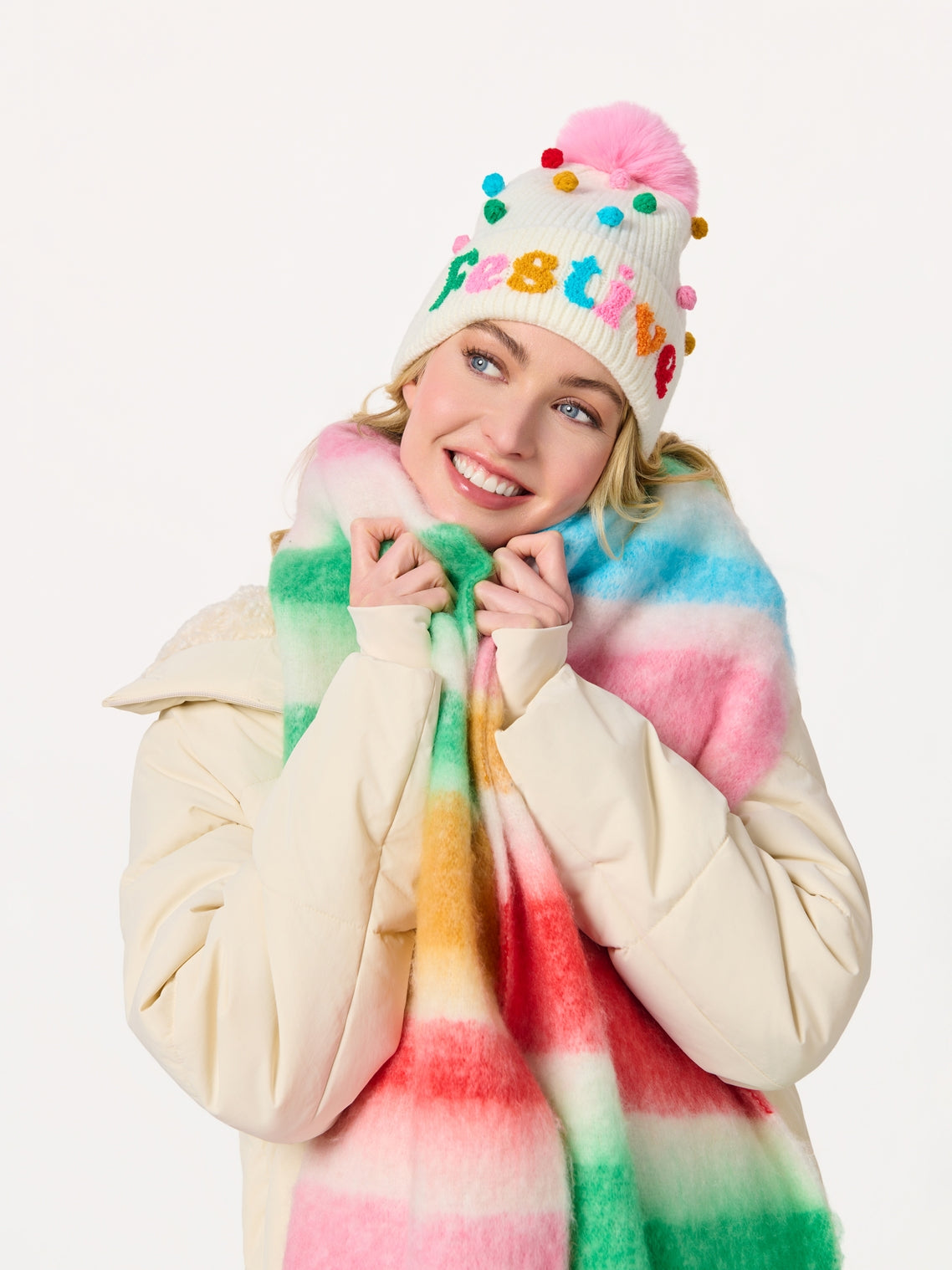Lala Scarf with colorful tie-dye stripes, styled with festive pom-pom beanie by SHIRALEAH