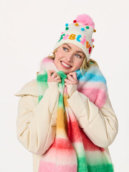 Lala Scarf with colorful tie-dye stripes, styled with festive pom-pom beanie by SHIRALEAH