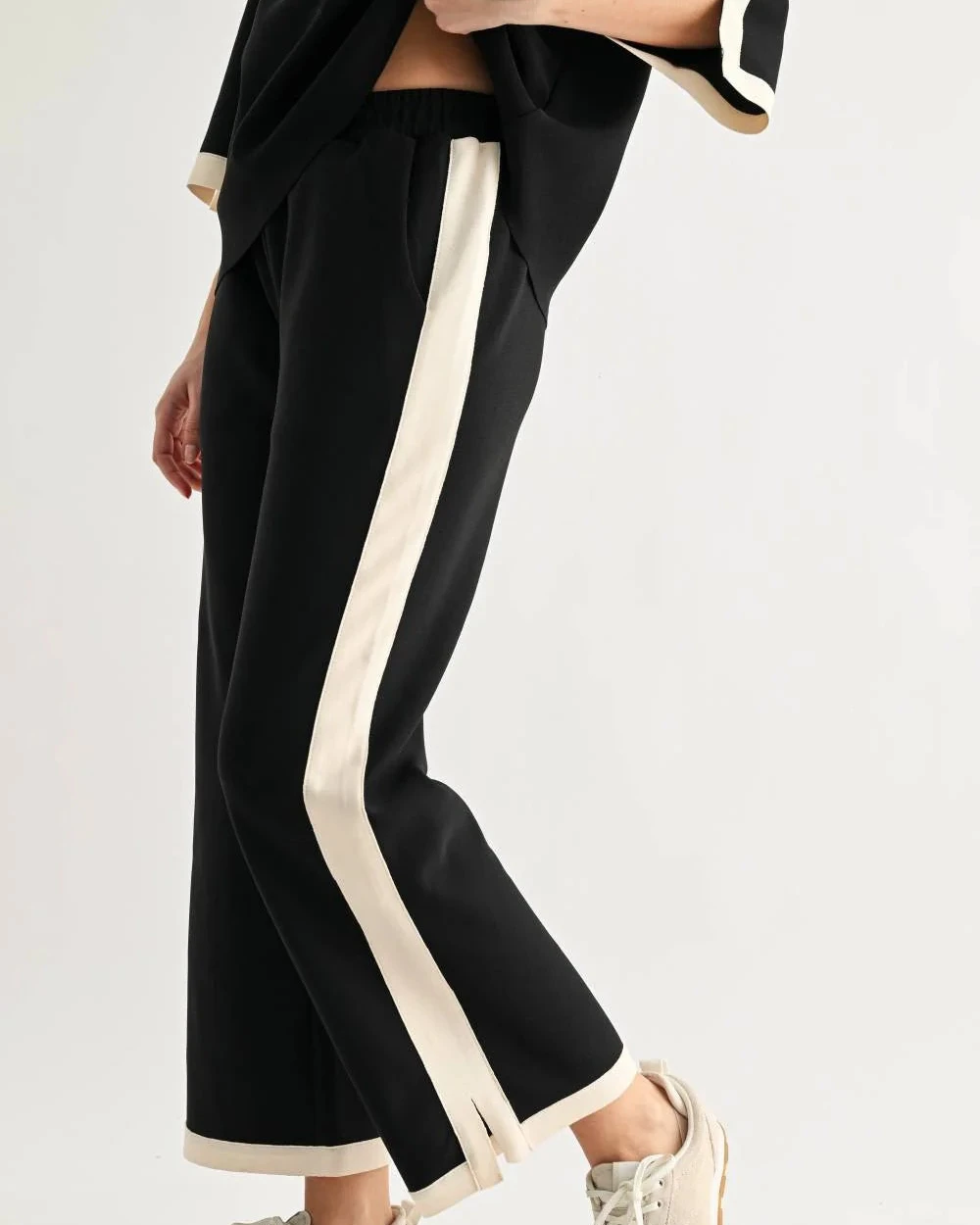 Kristopher Pant - Black by JOH APPAREL, wide-leg black pants with cream side stripes