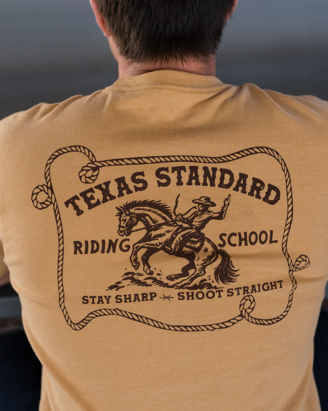 Heritage Printed Tee - Riding School in beige with vintage Texas rider art by TEXAS STANDARD