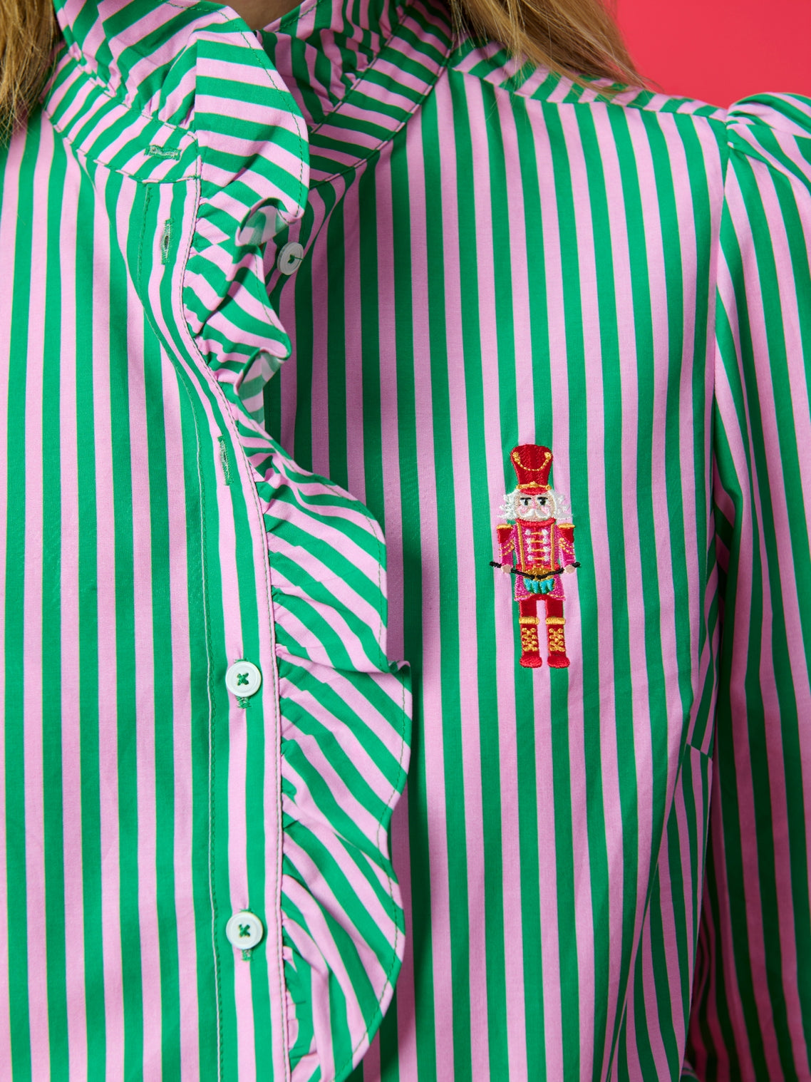 Close-up of Nutcracker Ruffle Blouse with green and pink stripes by SHIRALEAH at HCO FBG
