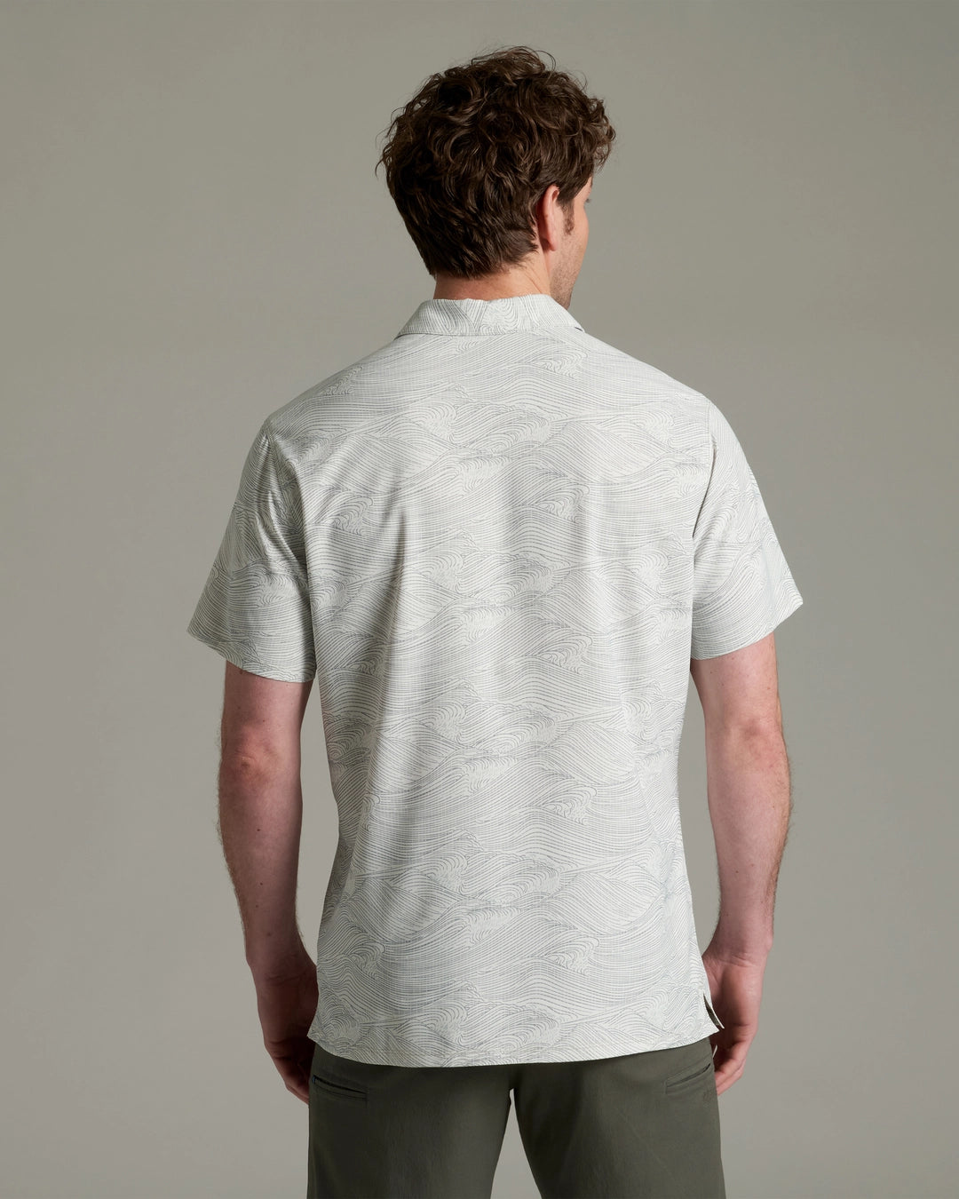 Persuadr Polo in light gray with subtle wave design, quick-dry, stretch, moisture-wicking by KUHL