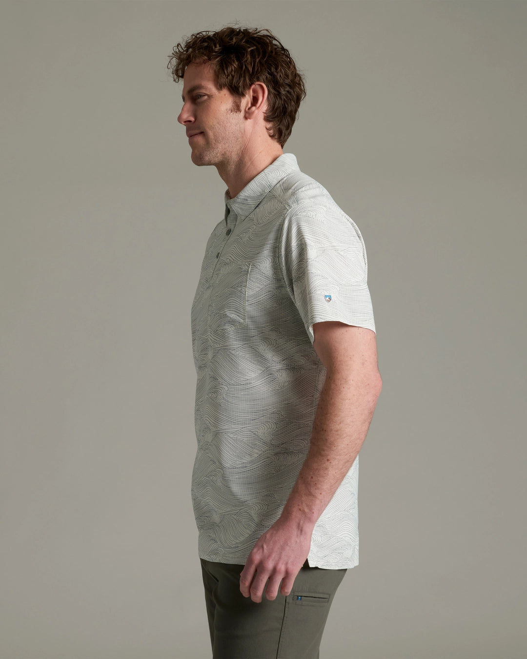 Persuadr Polo in light gray with subtle wave texture, quick-dry, stretch, moisture-wicking by KUHL