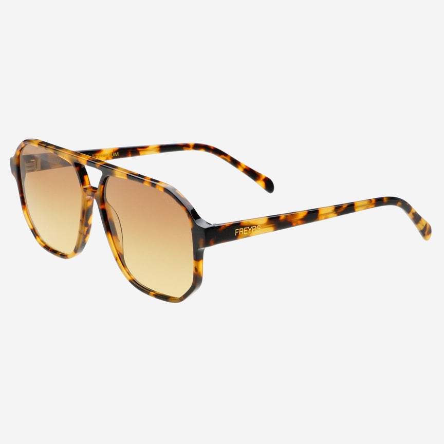 Billie sunglasses, brown frame, side profile with amber-tinted lenses