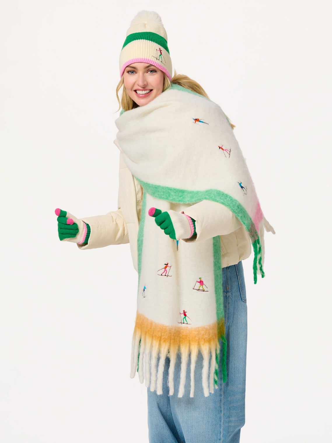 Woman wearing Alpine Scarf with colorful ski embroidery, styled with winter hat and gloves