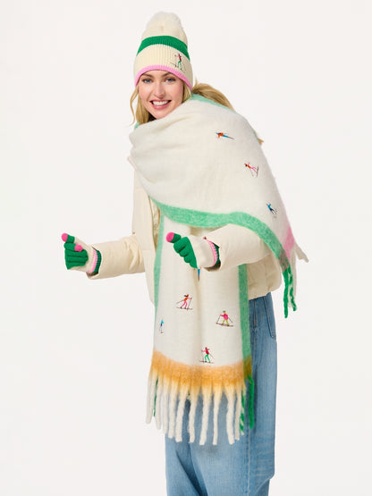Woman wearing Alpine Scarf with colorful ski embroidery, styled with winter hat and gloves